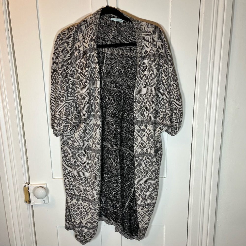 Maurice’s open sweater